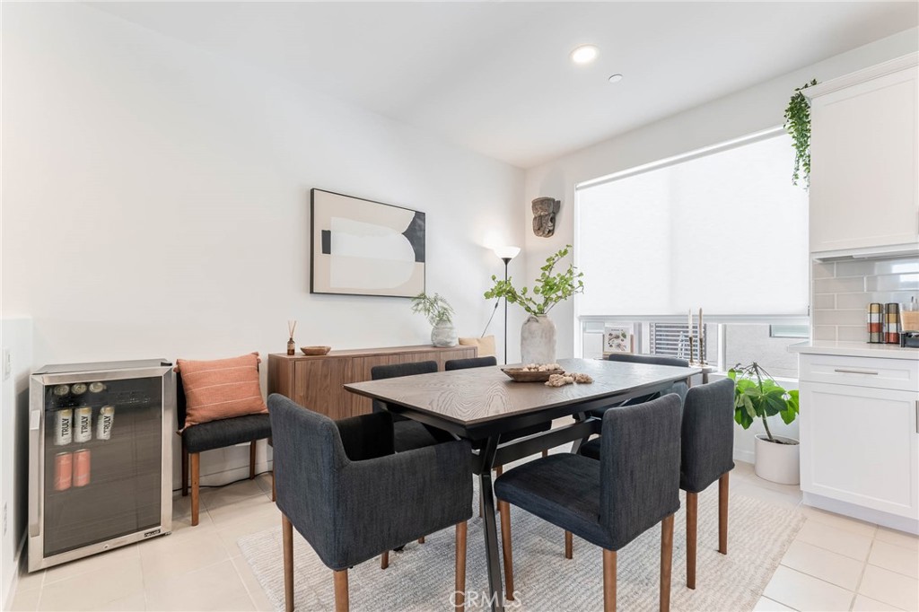 13161 Victory Boulevard Valley Glen, CA 91401 - Photo 14 of 33 a view of a dining room with furniture and a potted plant