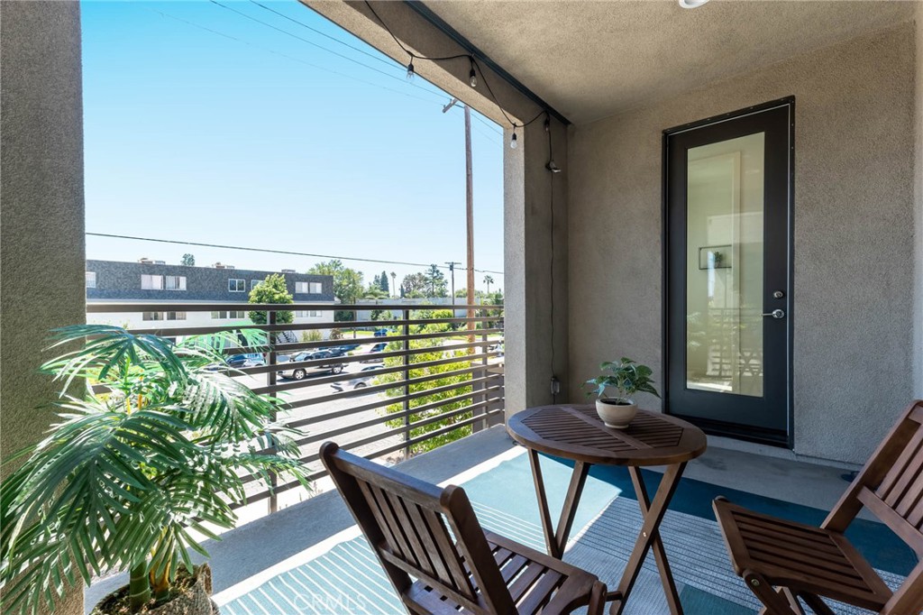 13161 Victory Boulevard Valley Glen, CA 91401 - Photo 17 of 33 a view of a balcony with chairs and a potted plant