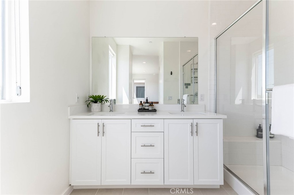 13161 Victory Boulevard Valley Glen, CA 91401 - Photo 21 of 33 a bathroom with a sink vanity and a mirror