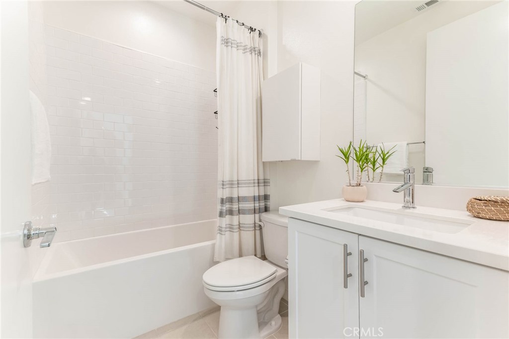 13161 Victory Boulevard Valley Glen, CA 91401 - Photo 23 of 33 a bathroom with a sink toilet and shower