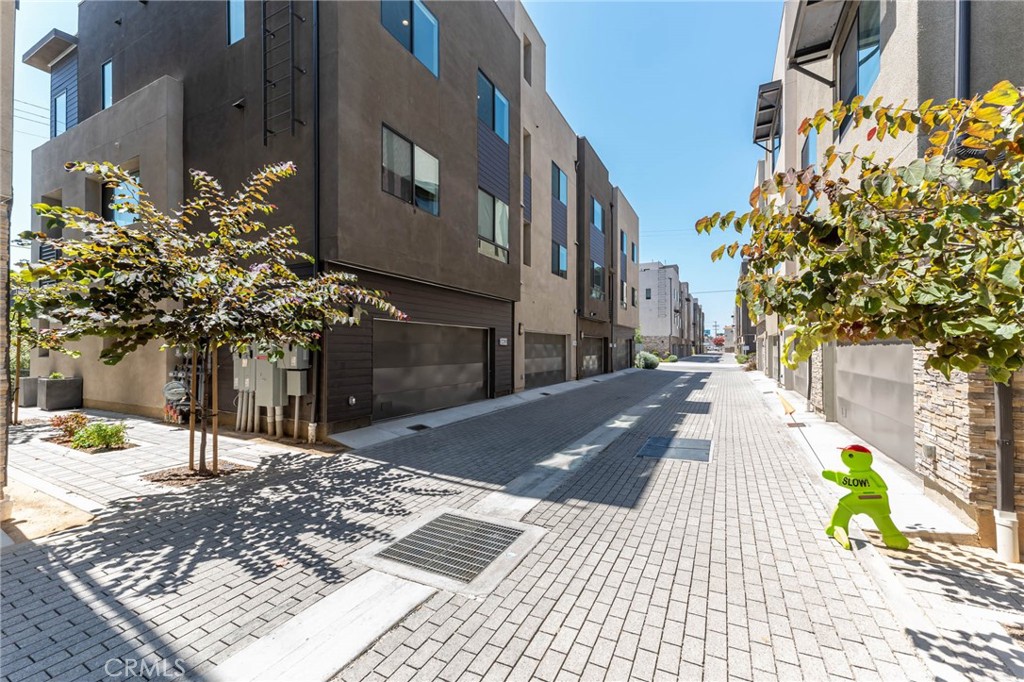 13161 Victory Boulevard Valley Glen, CA 91401 - Photo 3 of 33 a street view with tall buildings