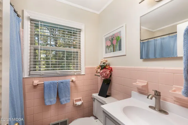 a bathroom with a sink and a toilet