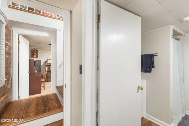 a view of a bathroom from a hallway