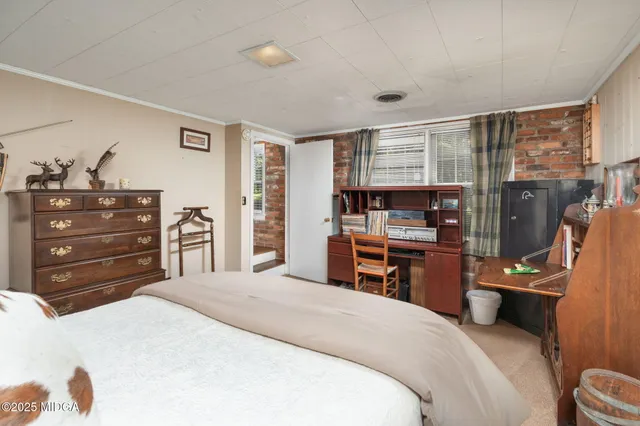 a bedroom with a bed and furniture