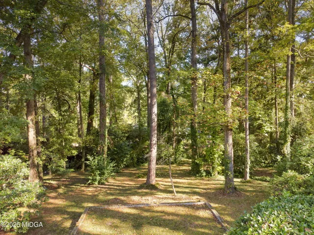 a view of a house with basketball court