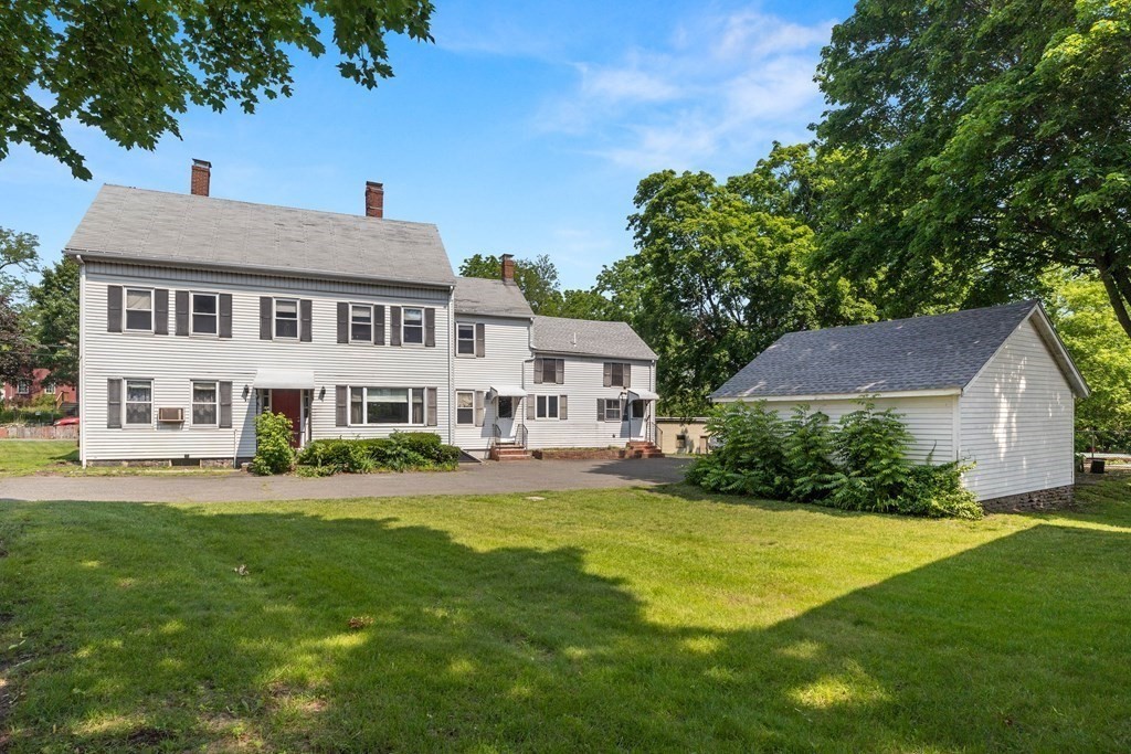 31 Andover Street Peabody, MA 01960 - Photo 1 of 40 a front view of a house with a garden