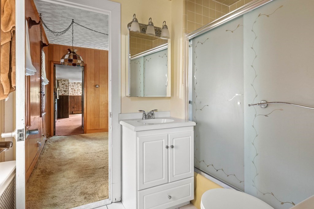 31 Andover Street Peabody, MA 01960 - Photo 14 of 40 a bathroom with a sink and a mirror