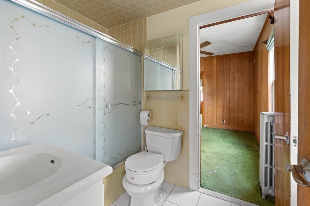 31 Andover Street Peabody, MA 01960 - Photo 15 of 40 a bathroom with a toilet and a shower