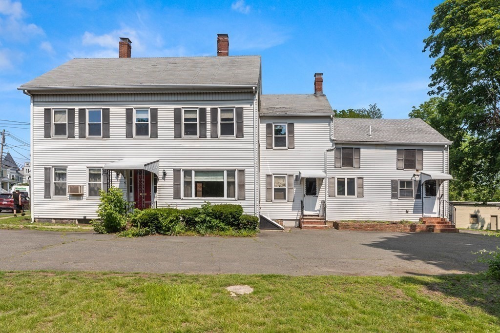 31 Andover Street Peabody, MA 01960 - Photo 2 of 40 a front view of a house with garden