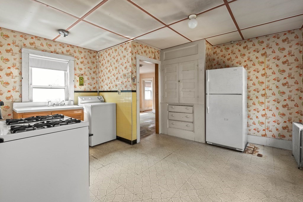 31 Andover Street Peabody, MA 01960 - Photo 23 of 40 a utility room with dryer and washer
