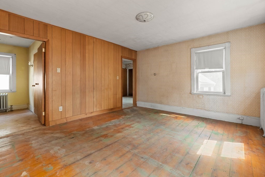 31 Andover Street Peabody, MA 01960 - Photo 25 of 40 an empty room with windows and closet