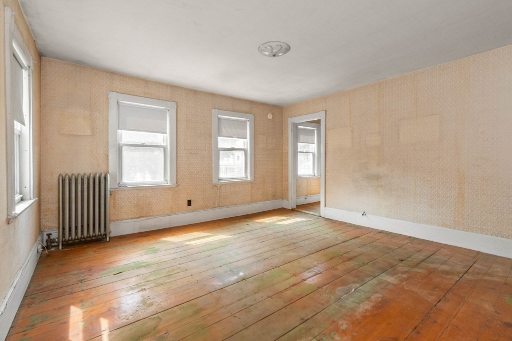 31 Andover Street Peabody, MA 01960 - Photo 26 of 40 a view of empty room with wooden floor and fan