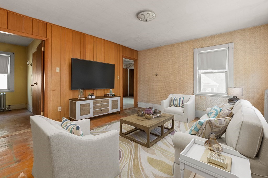 31 Andover Street Peabody, MA 01960 - Photo 27 of 40 a living room with furniture and a flat screen tv