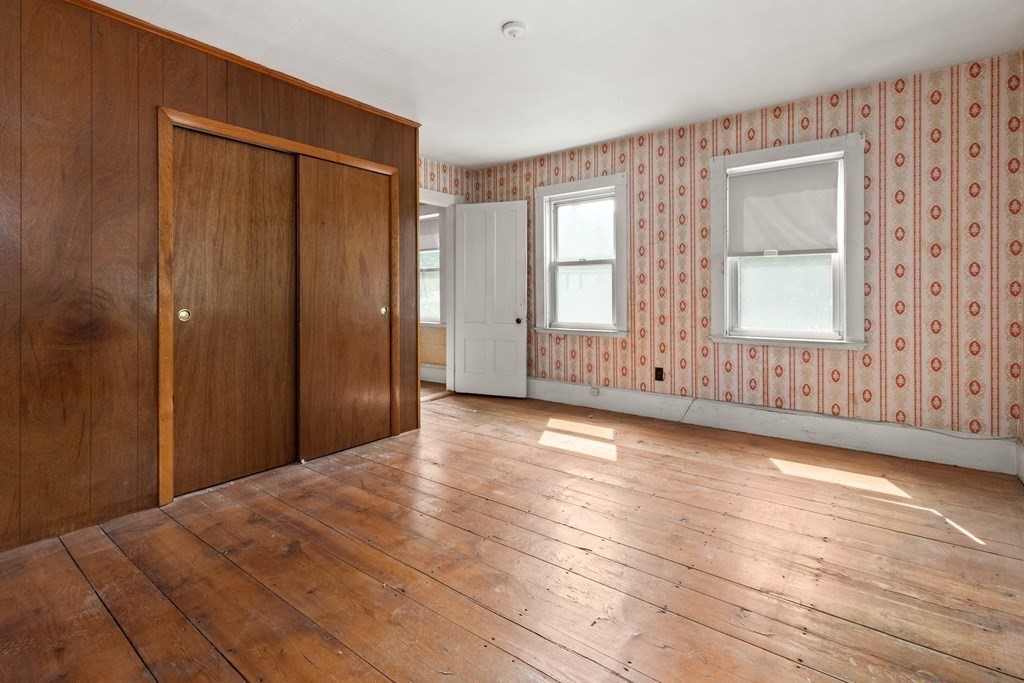 31 Andover Street Peabody, MA 01960 - Photo 36 of 40 a view of an empty room with wooden floor and a window