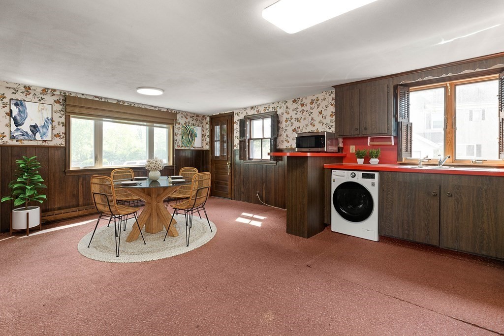 31 Andover Street Peabody, MA 01960 - Photo 5 of 40 a kitchen with a stove a table and chairs