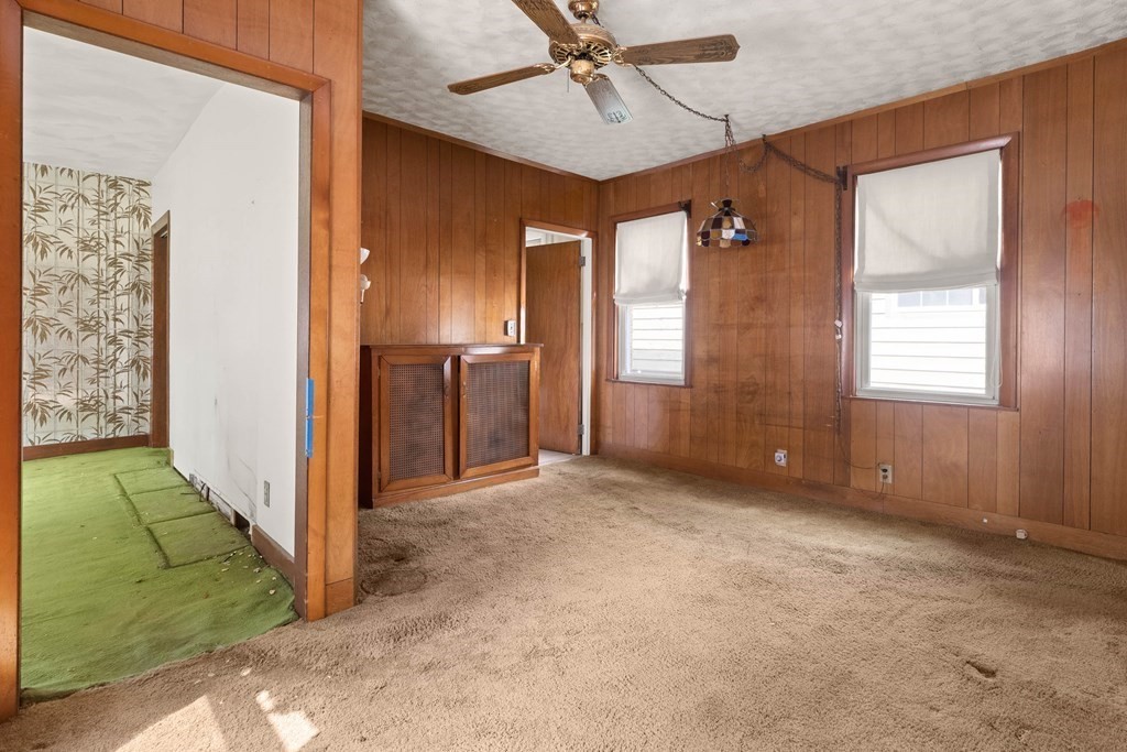 31 Andover Street Peabody, MA 01960 - Photo 8 of 40 an empty room with windows and cabinet