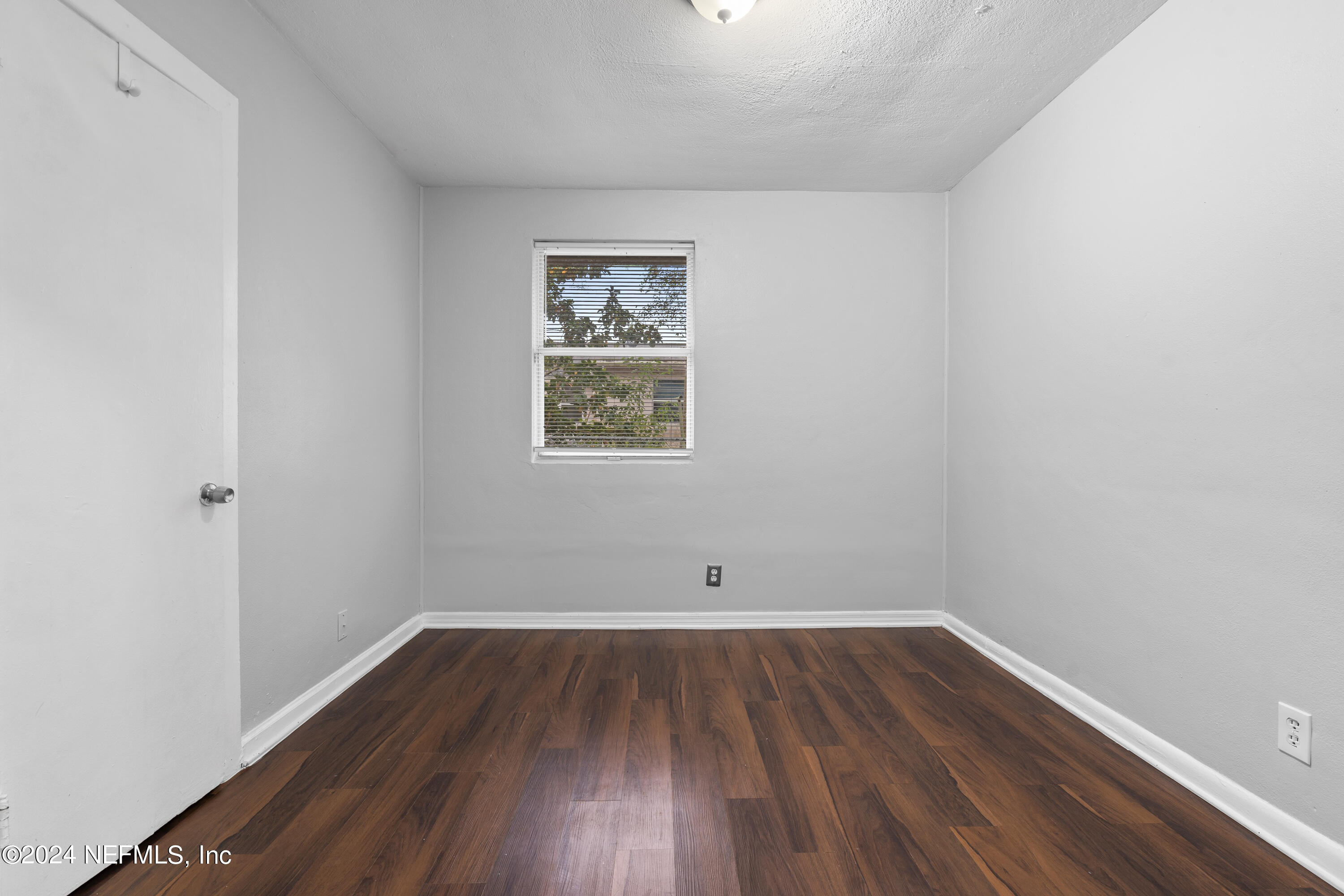 1174 Mohawk Street Jacksonville, FL 32205 - Photo 18 of 33 a view of a room with wooden floor and window