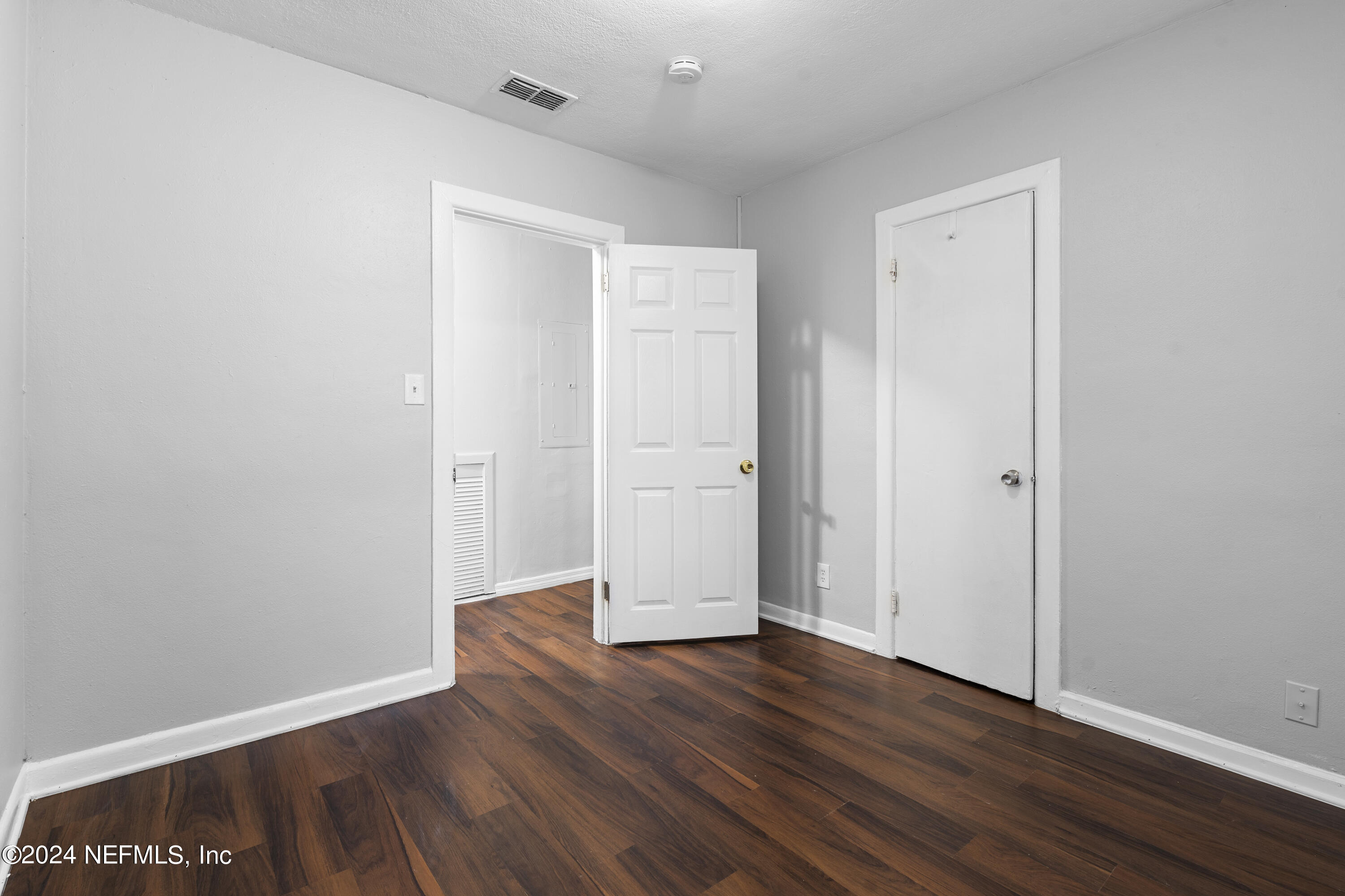 1174 Mohawk Street Jacksonville, FL 32205 - Photo 19 of 33 a view of an empty room with wooden floor