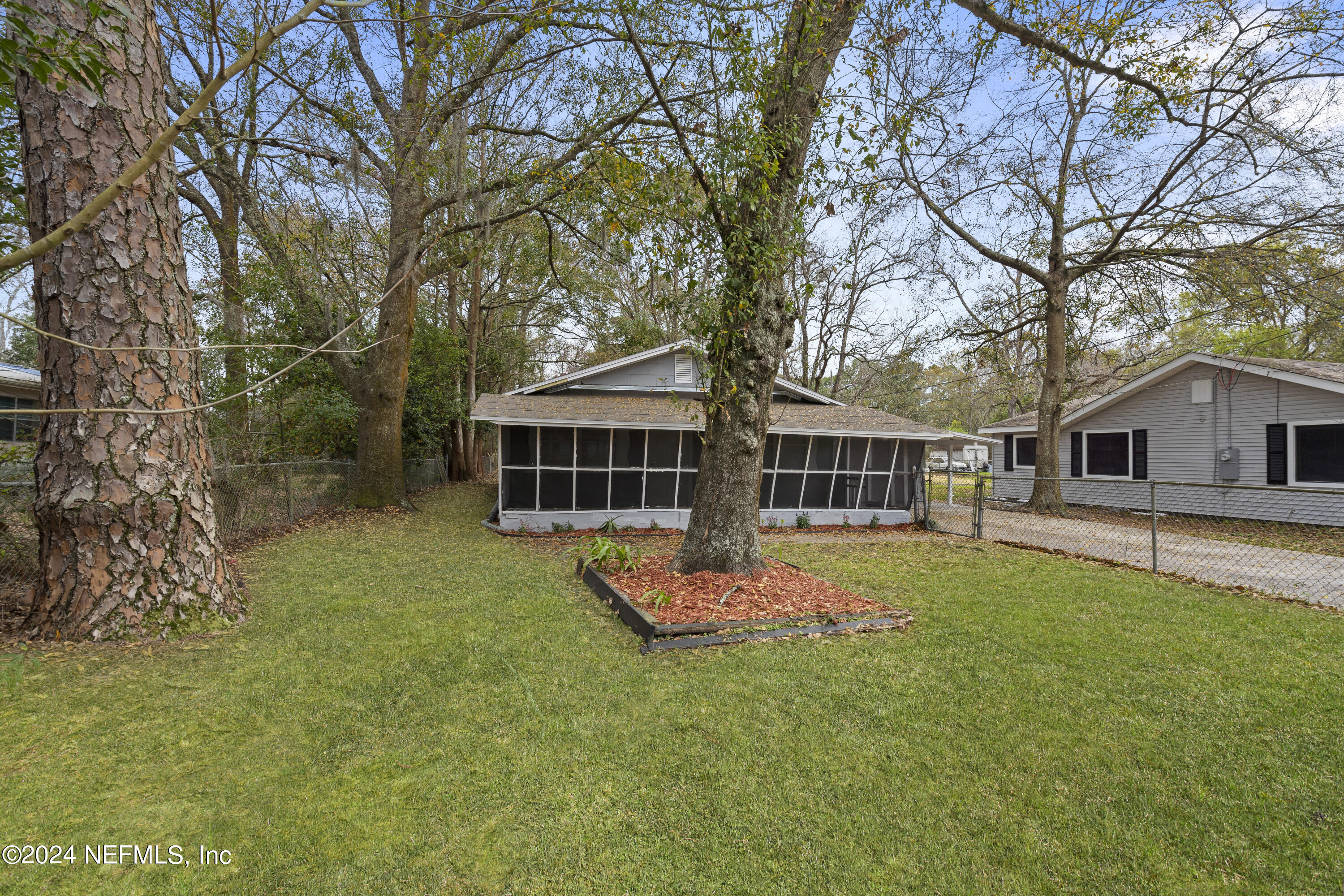 1174 Mohawk Street Jacksonville, FL 32205 - Photo 2 of 33 a front view of a house with a garden