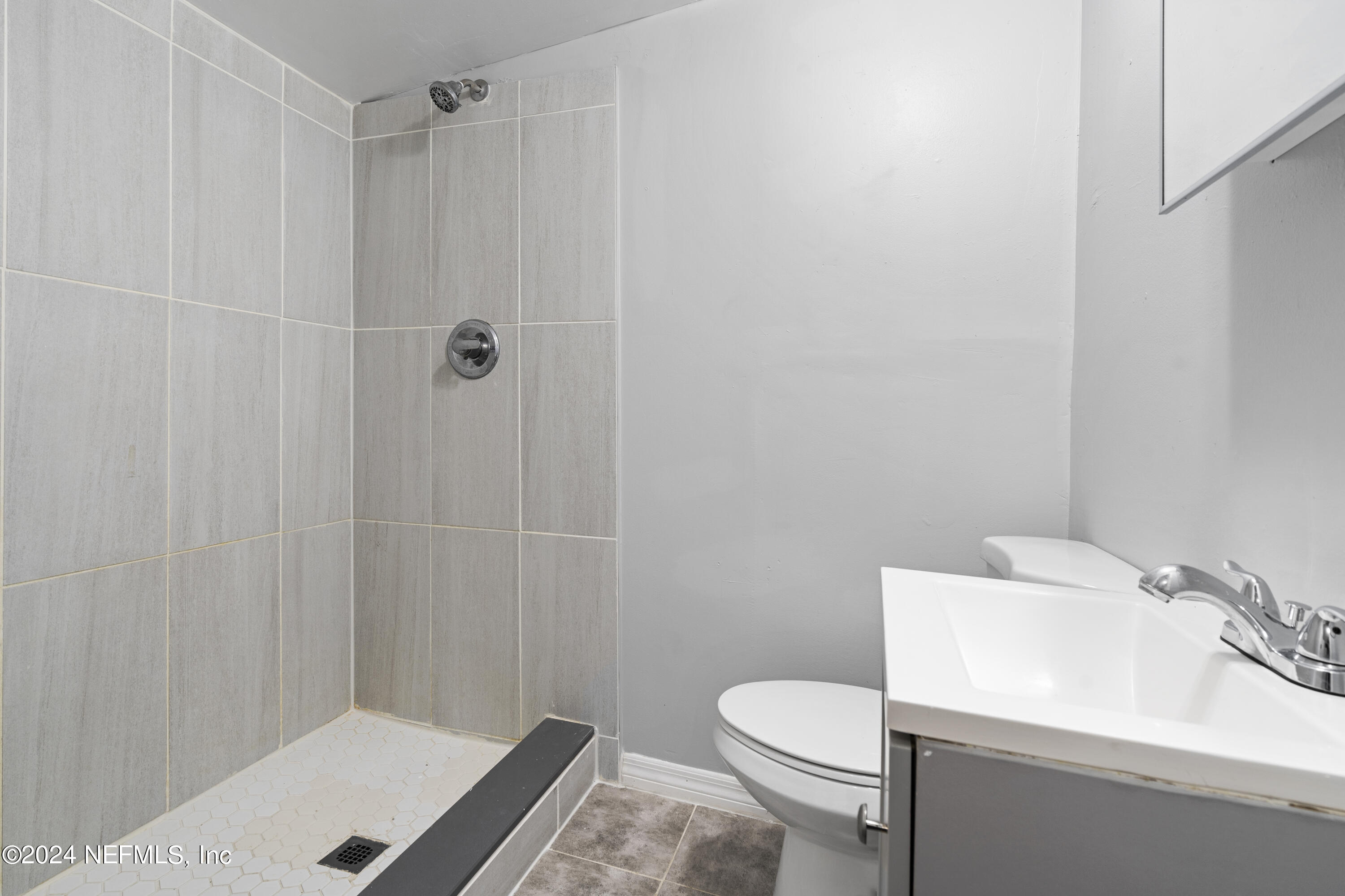1174 Mohawk Street Jacksonville, FL 32205 - Photo 21 of 33 a bathroom with a sink a toilet and shower