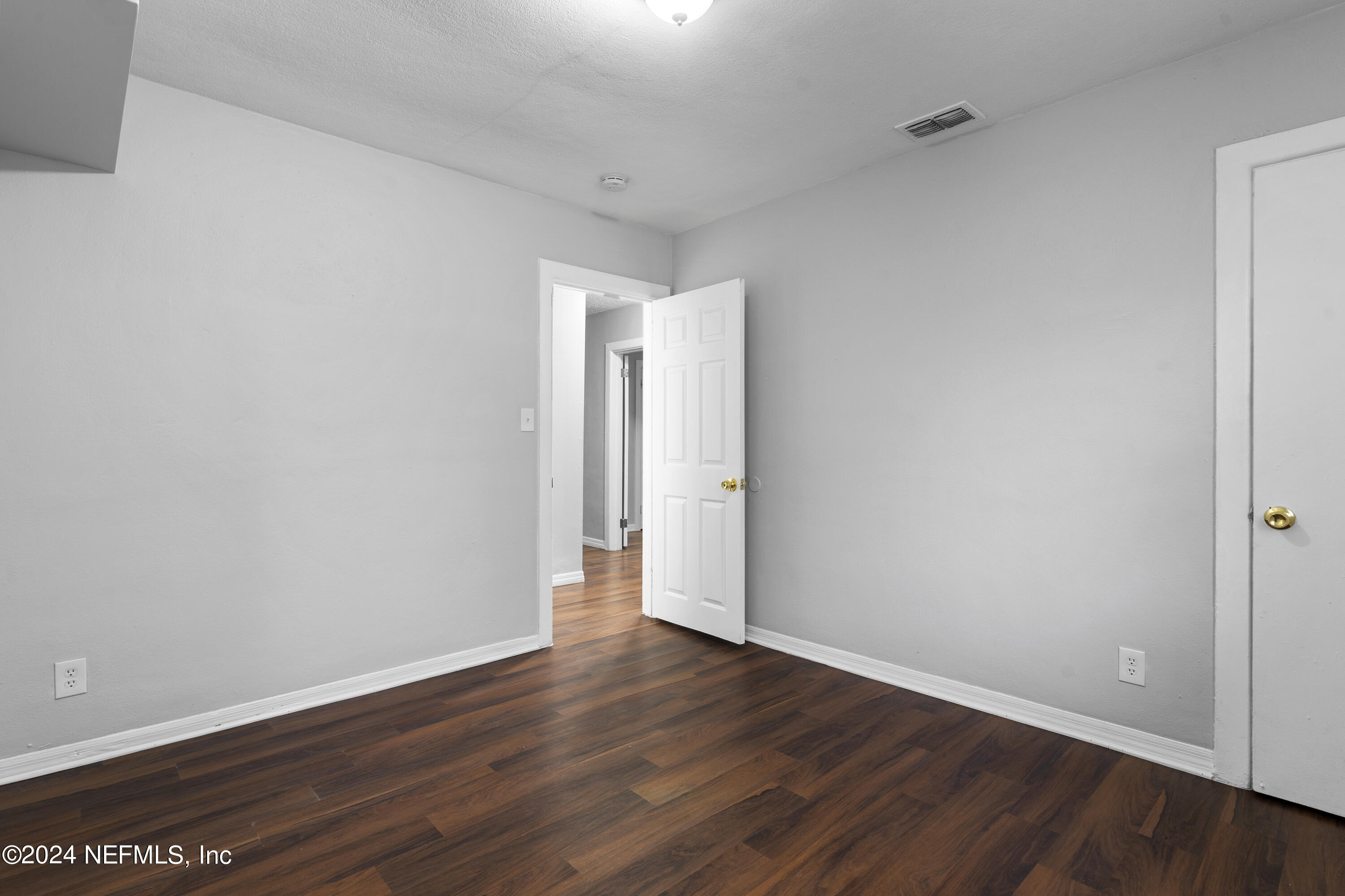 1174 Mohawk Street Jacksonville, FL 32205 - Photo 25 of 33 a view of an empty room with wooden floor