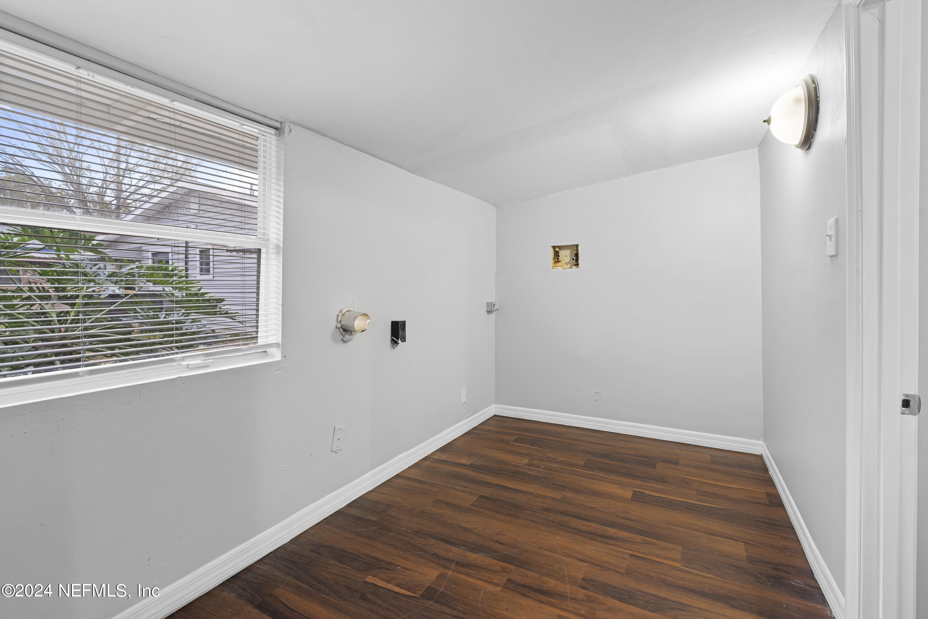 1174 Mohawk Street Jacksonville, FL 32205 - Photo 28 of 33 a view of a room with wooden floor and window