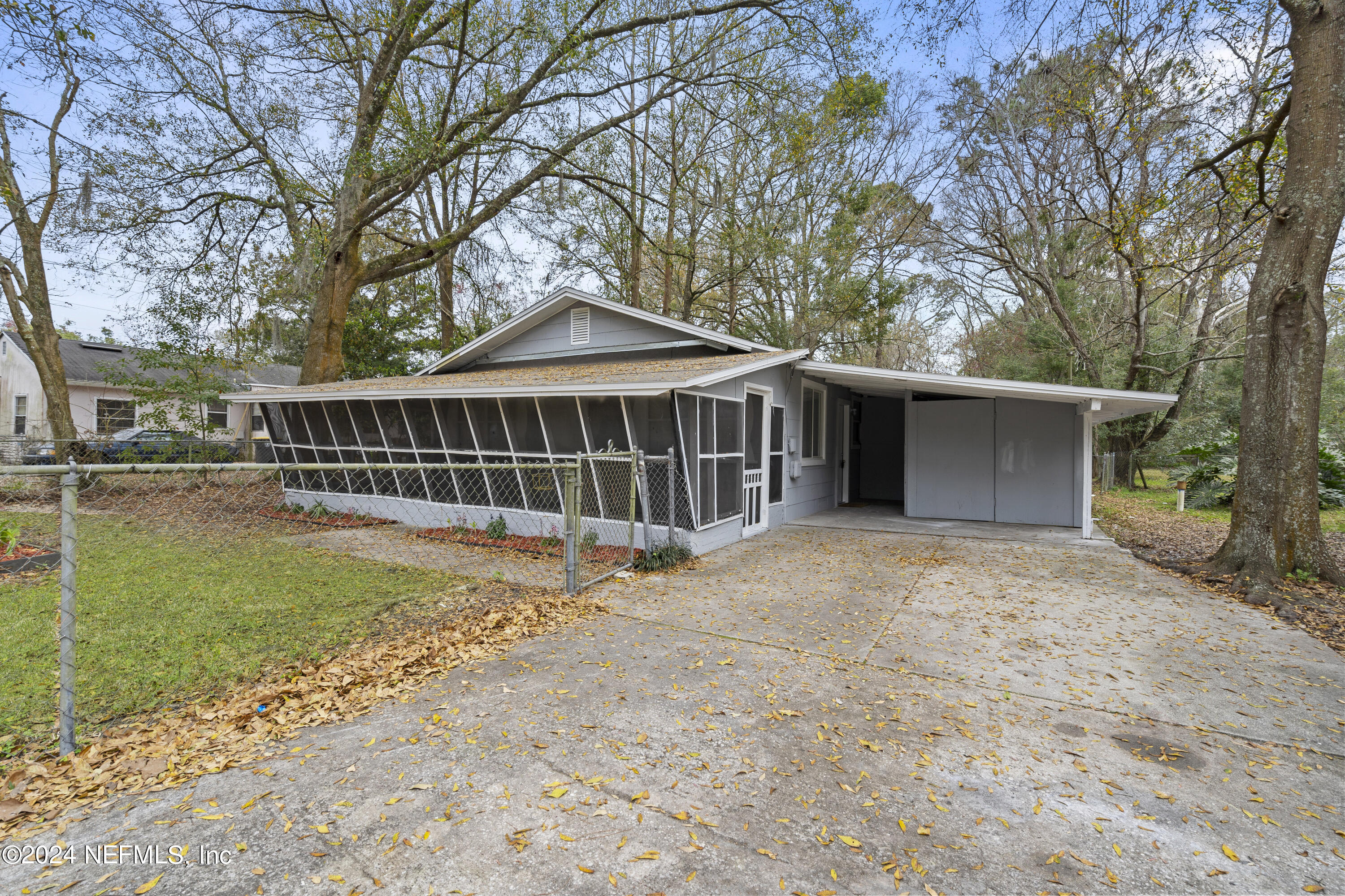 1174 Mohawk Street Jacksonville, FL 32205 - Photo 4 of 33 a view of a house with a yard and a large tree