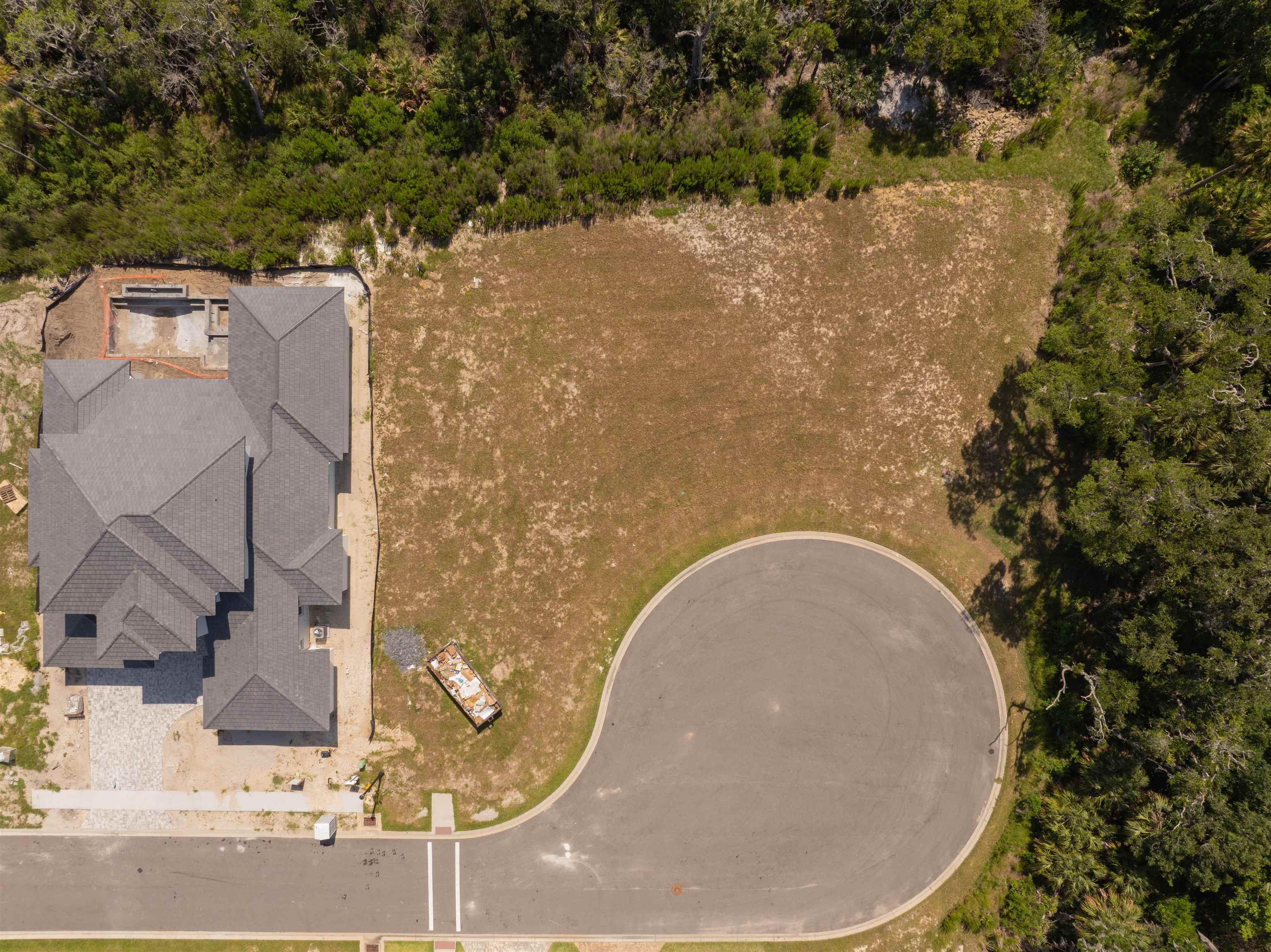 5 Coronado Road Flagler Beach, FL 32136 - Photo 2 of 18 an aerial view of a house with a yard and lake view