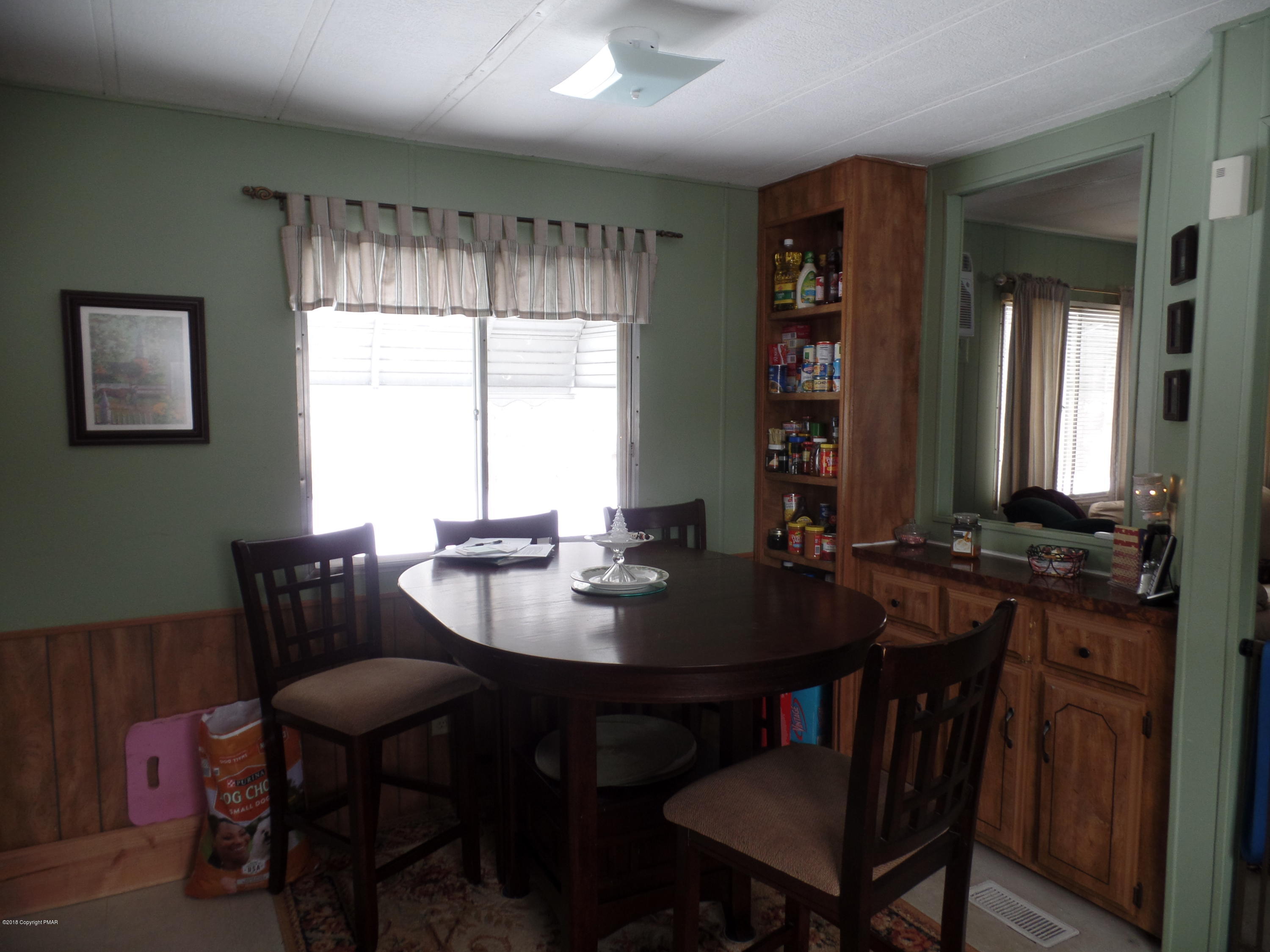 168 Fawn Valley Road Stroudsburg, PA 18360 - Photo 4 of 12 a view of a dining room with furniture and window