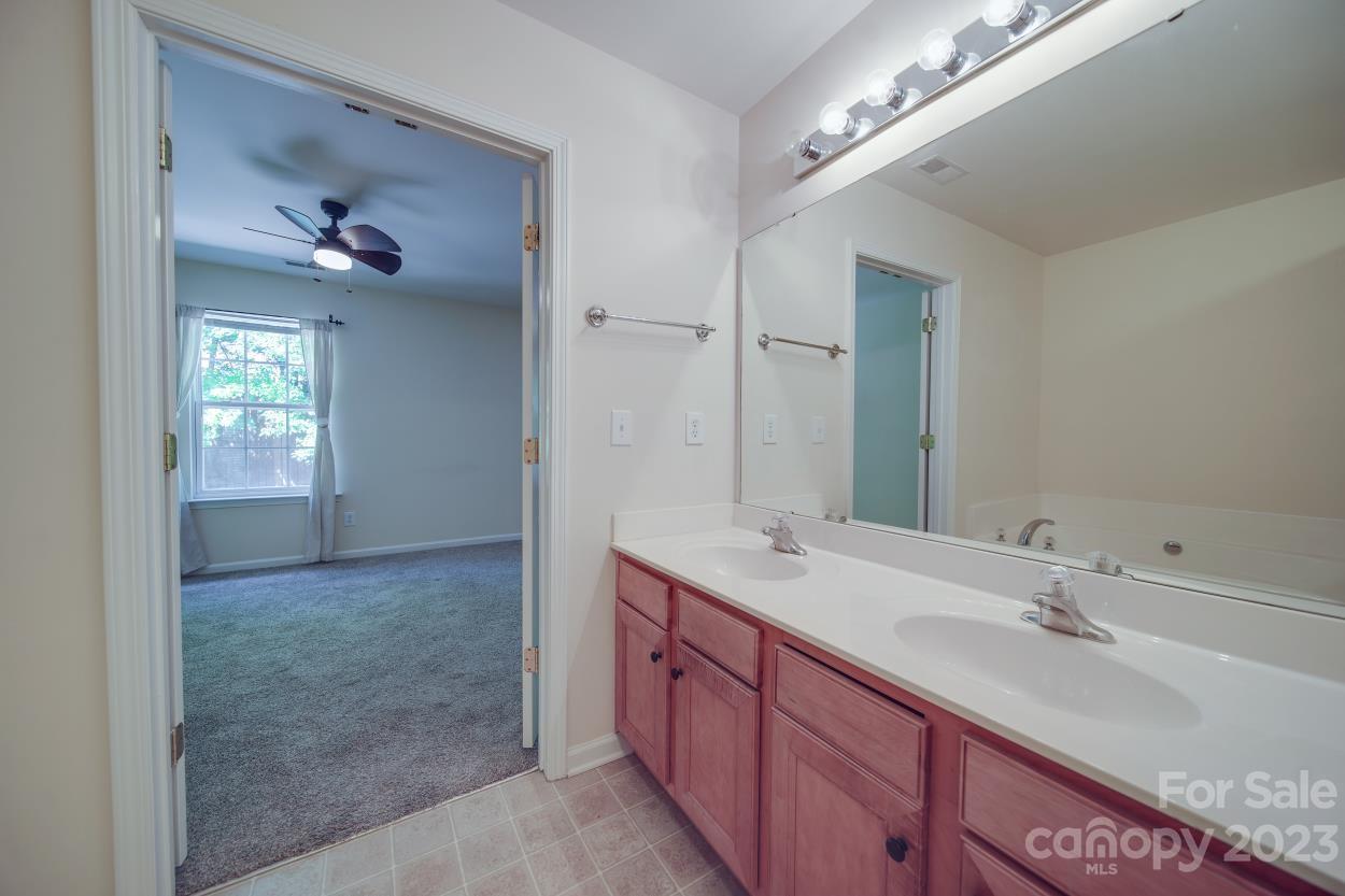 1919 Travertine Lane Fort Mill, SC 29708 - Photo 21 of 34 a bathroom with a sink double vanity and a mirror