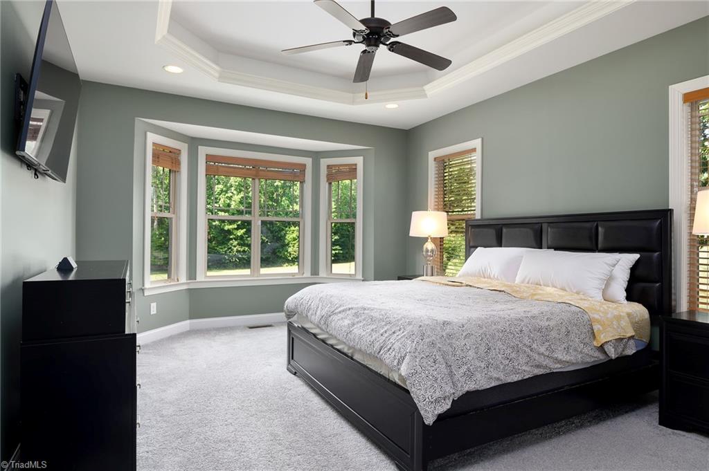 8931 Grove Park Drive Oak Ridge, NC 27310 - Photo 15 of 36 Primary filled with natural light