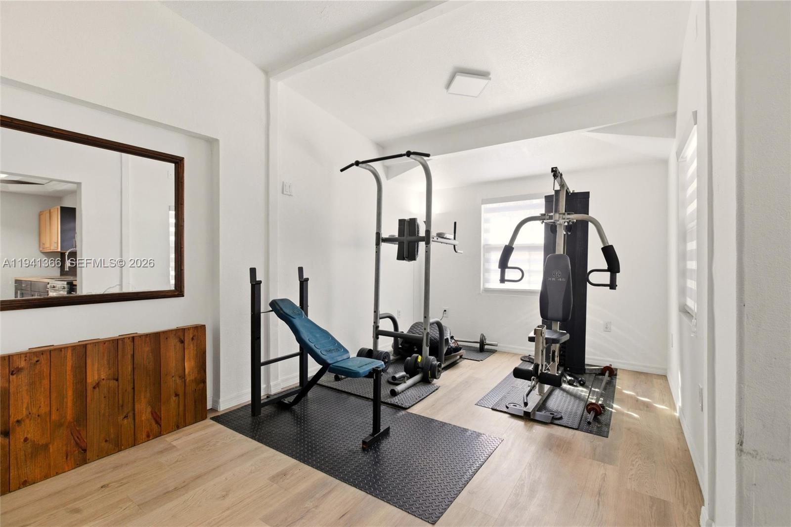 2124 Gardenview Road Sebring, FL 33870 - Photo 14 of 54 a view of a workspace with wooden floor and windows