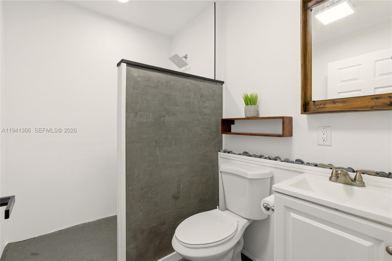 2124 Gardenview Road Sebring, FL 33870 - Photo 16 of 54 a bathroom with a granite countertop toilet and a sink