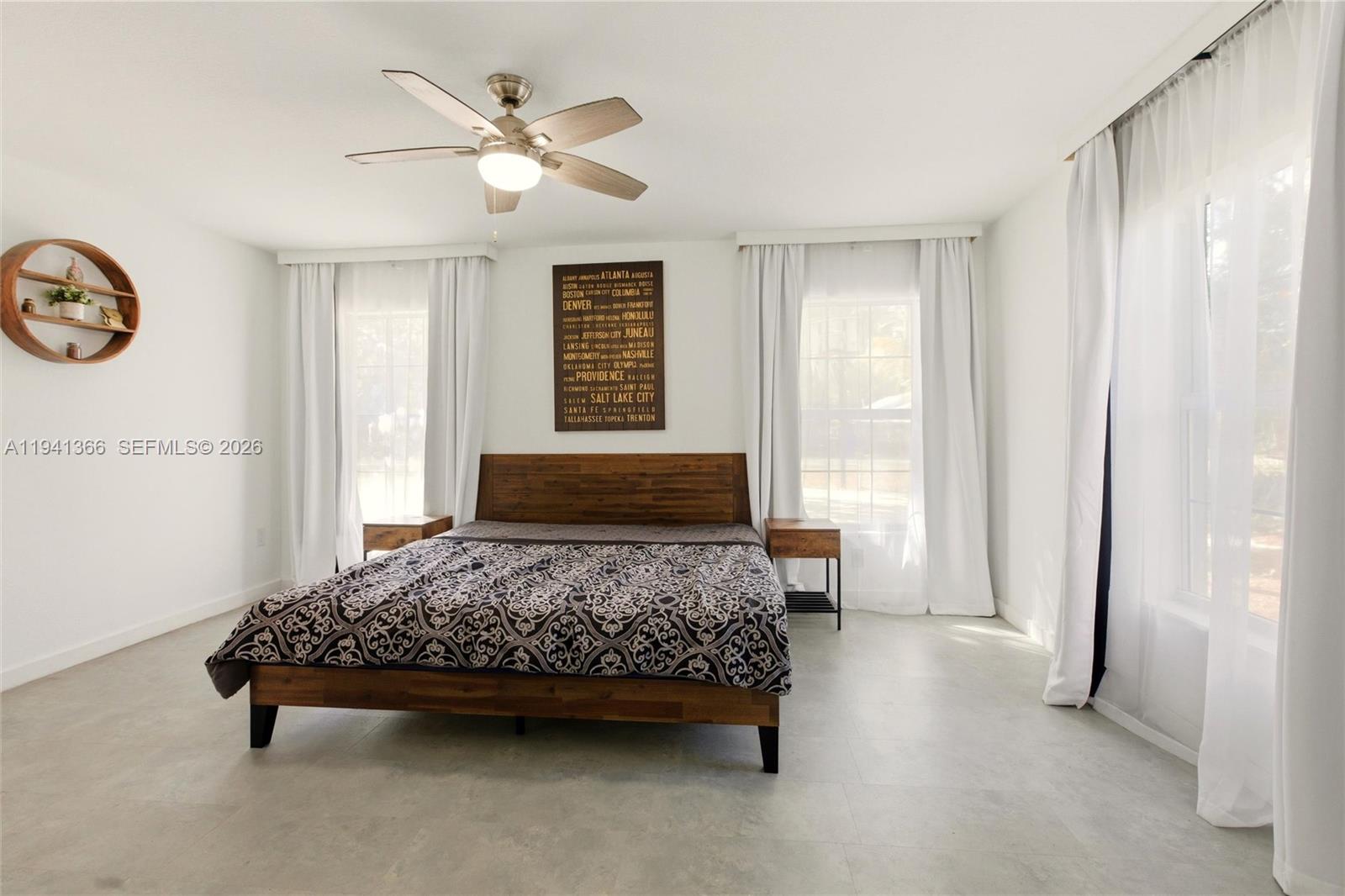 2124 Gardenview Road Sebring, FL 33870 - Photo 17 of 54 a bedroom with a bed and a window