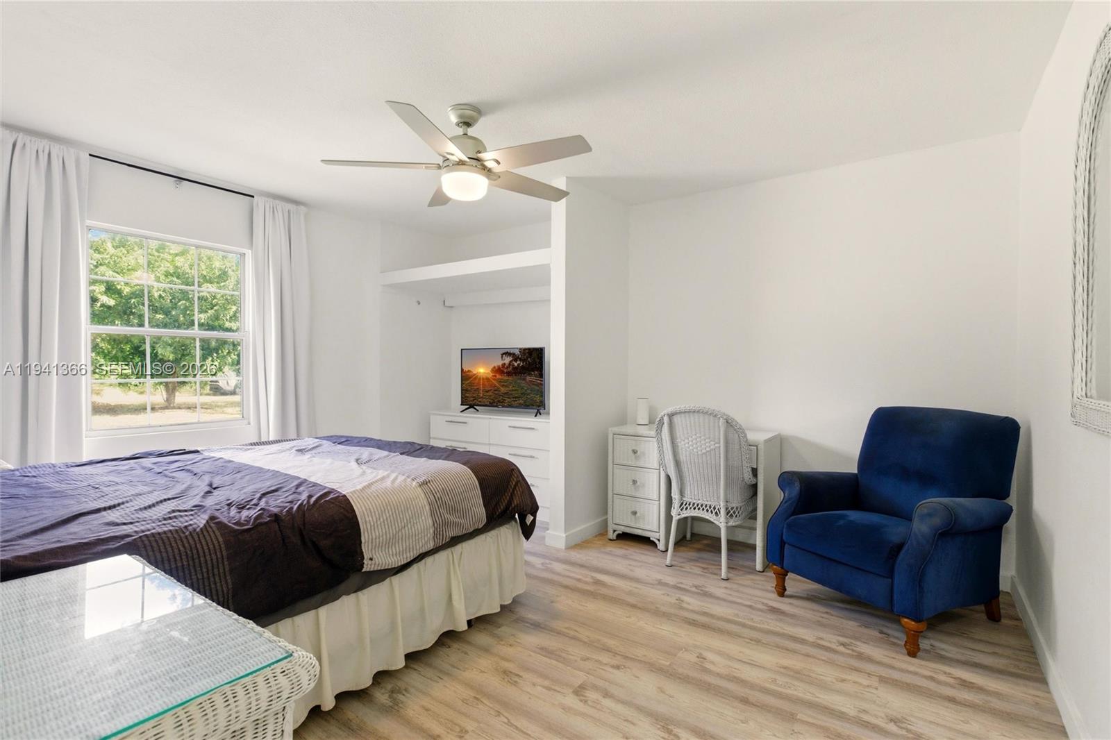 2124 Gardenview Road Sebring, FL 33870 - Photo 22 of 54 a bedroom with bed couch and window