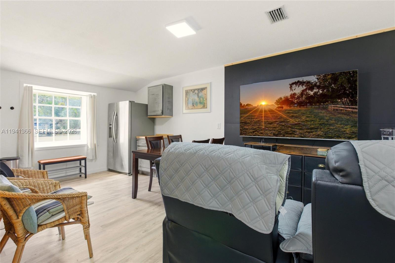 2124 Gardenview Road Sebring, FL 33870 - Photo 30 of 54 a bedroom with a bed and large windows