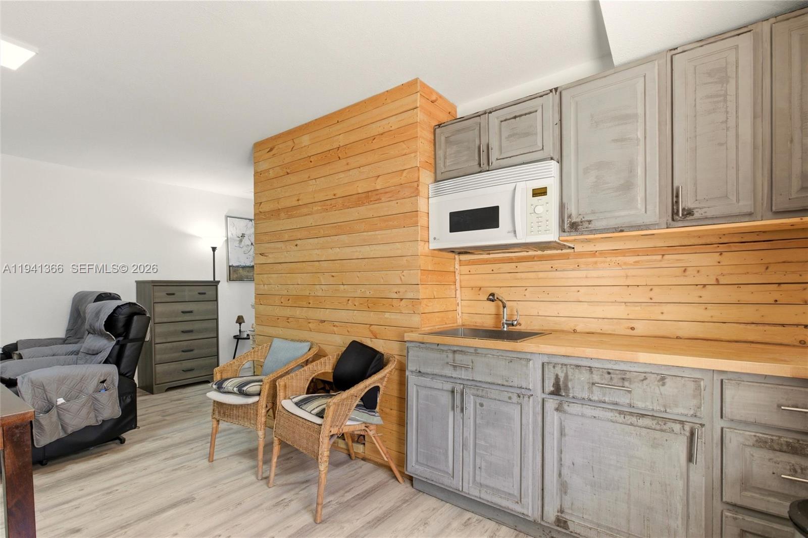 2124 Gardenview Road Sebring, FL 33870 - Photo 34 of 54 a kitchen with a sink cabinets and wooden floor