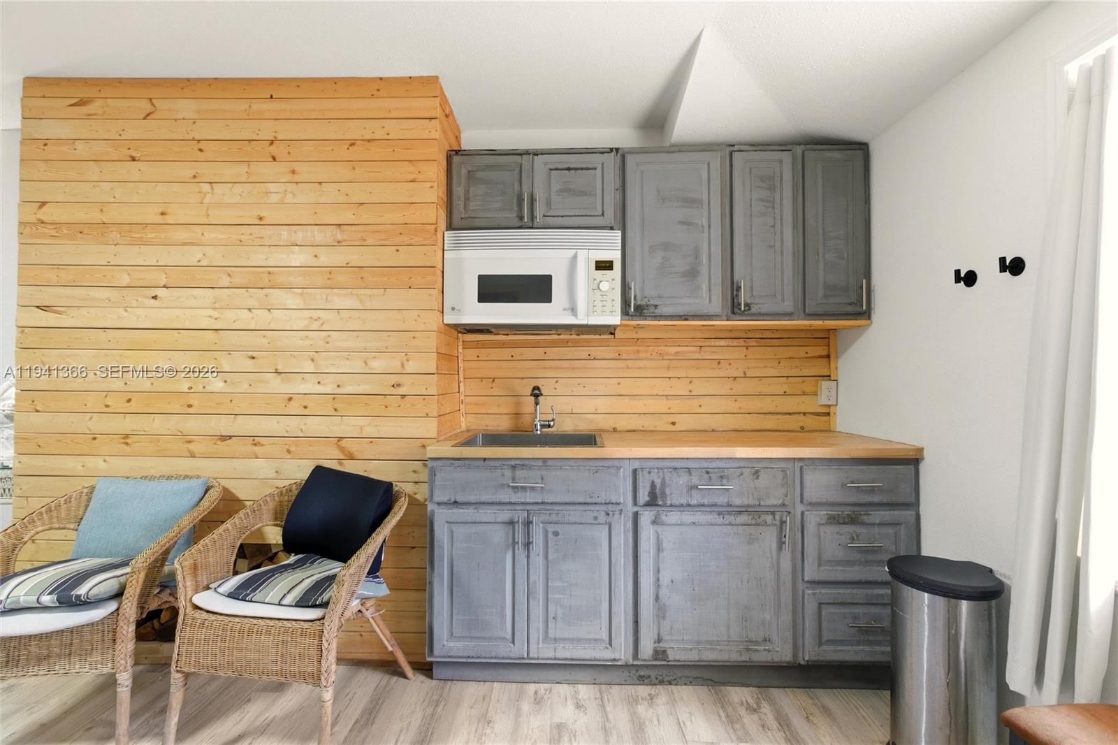 2124 Gardenview Road Sebring, FL 33870 - Photo 36 of 54 a kitchen with a sink and cabinets