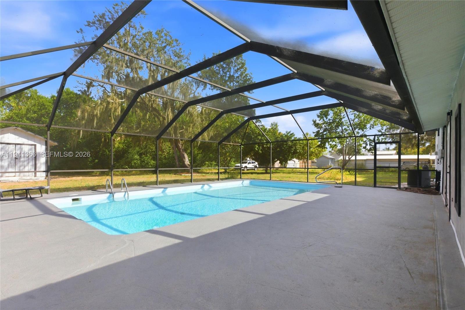 2124 Gardenview Road Sebring, FL 33870 - Photo 43 of 54 a view of a swimming pool with a yard