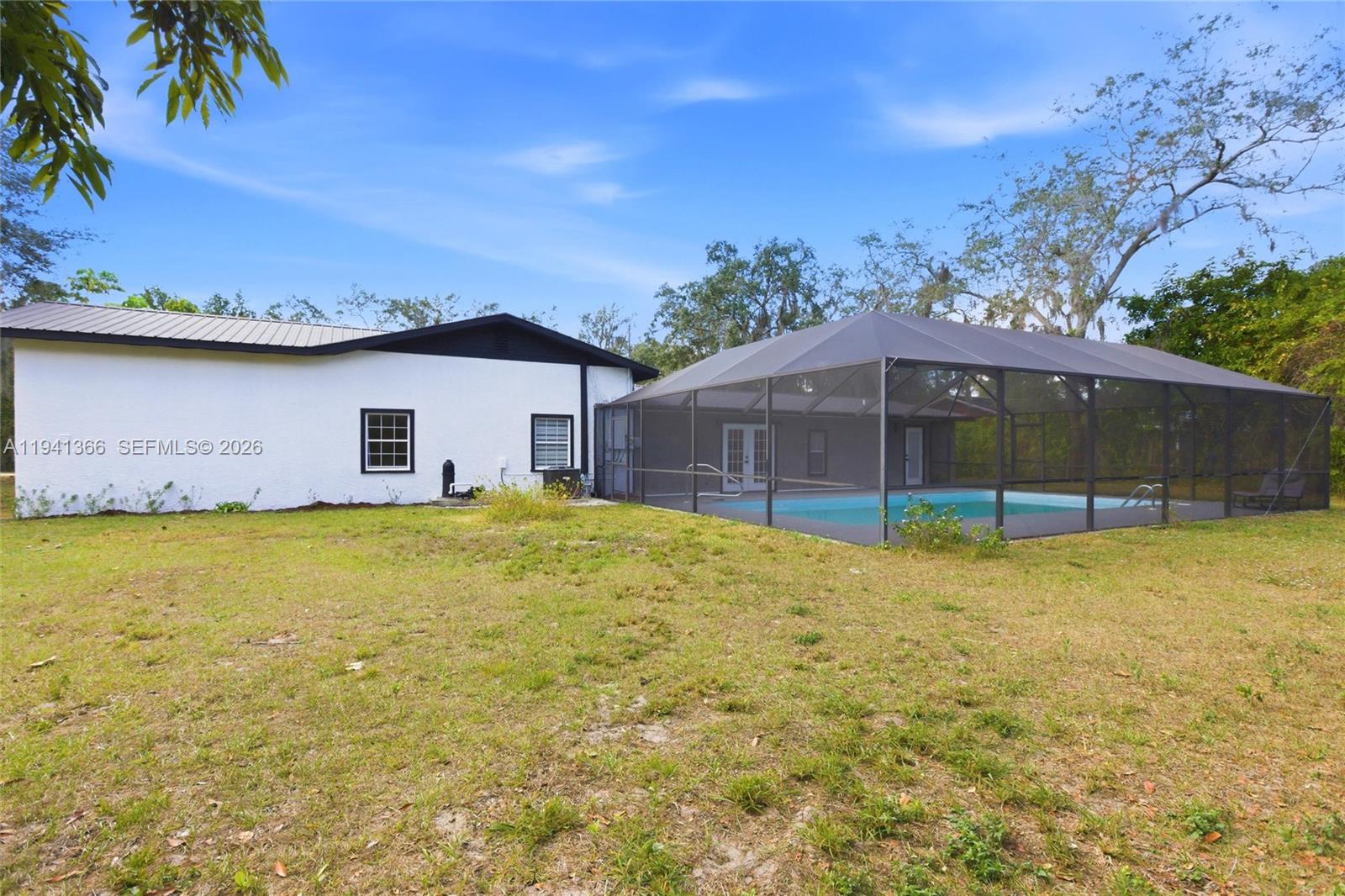 2124 Gardenview Road Sebring, FL 33870 - Photo 46 of 54 a house view with a swimming pool