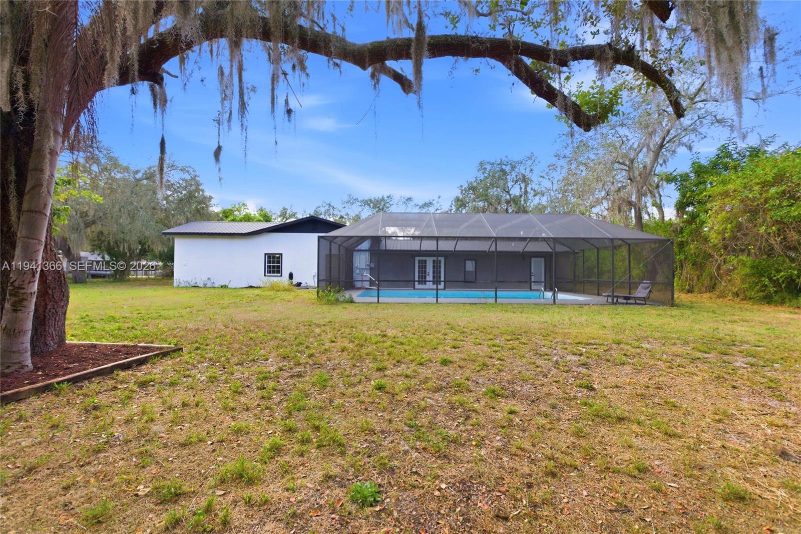 2124 Gardenview Road Sebring, FL 33870 - Photo 47 of 54 a front view of a house with a yard