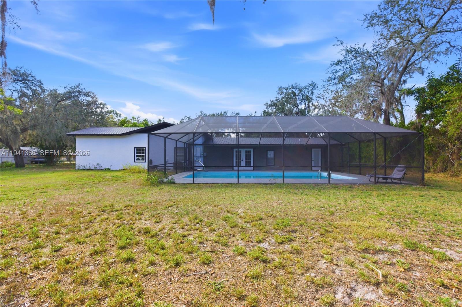 2124 Gardenview Road Sebring, FL 33870 - Photo 48 of 54 a front view of a house with a yard