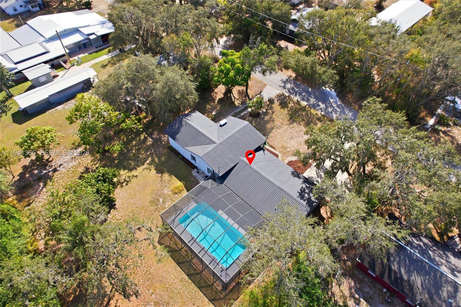 2124 Gardenview Road Sebring, FL 33870 - Photo 52 of 54 an aerial view of a house with a yard