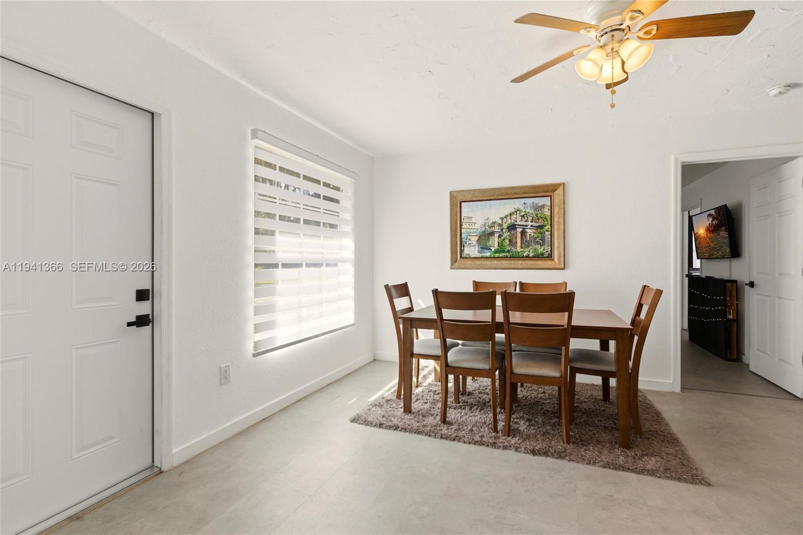 2124 Gardenview Road Sebring, FL 33870 - Photo 7 of 54 a view of a dining room with furniture and a window