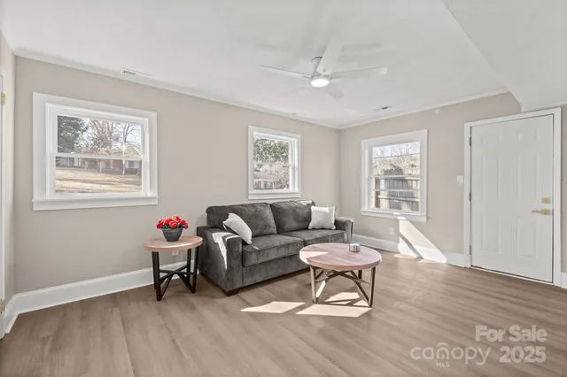 a living room with furniture and a window