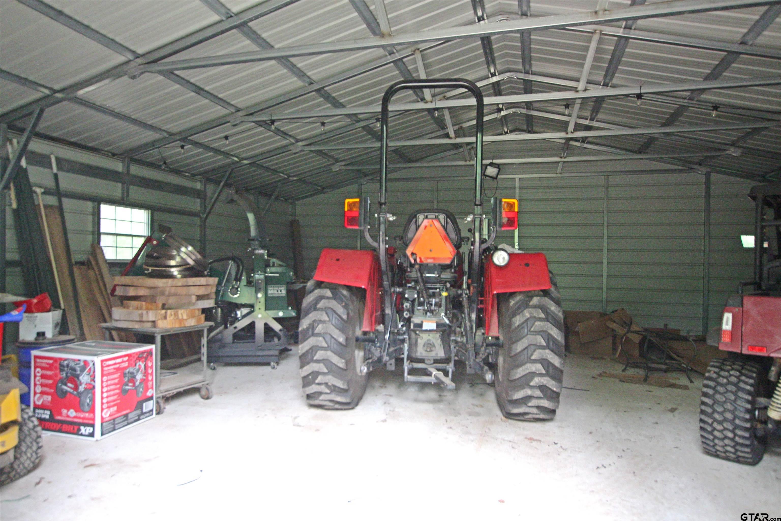 782 Rosie Wady Road Gladewater, TX 75647 - Photo 33 of 48 a view of a storage room with a lot of stuff