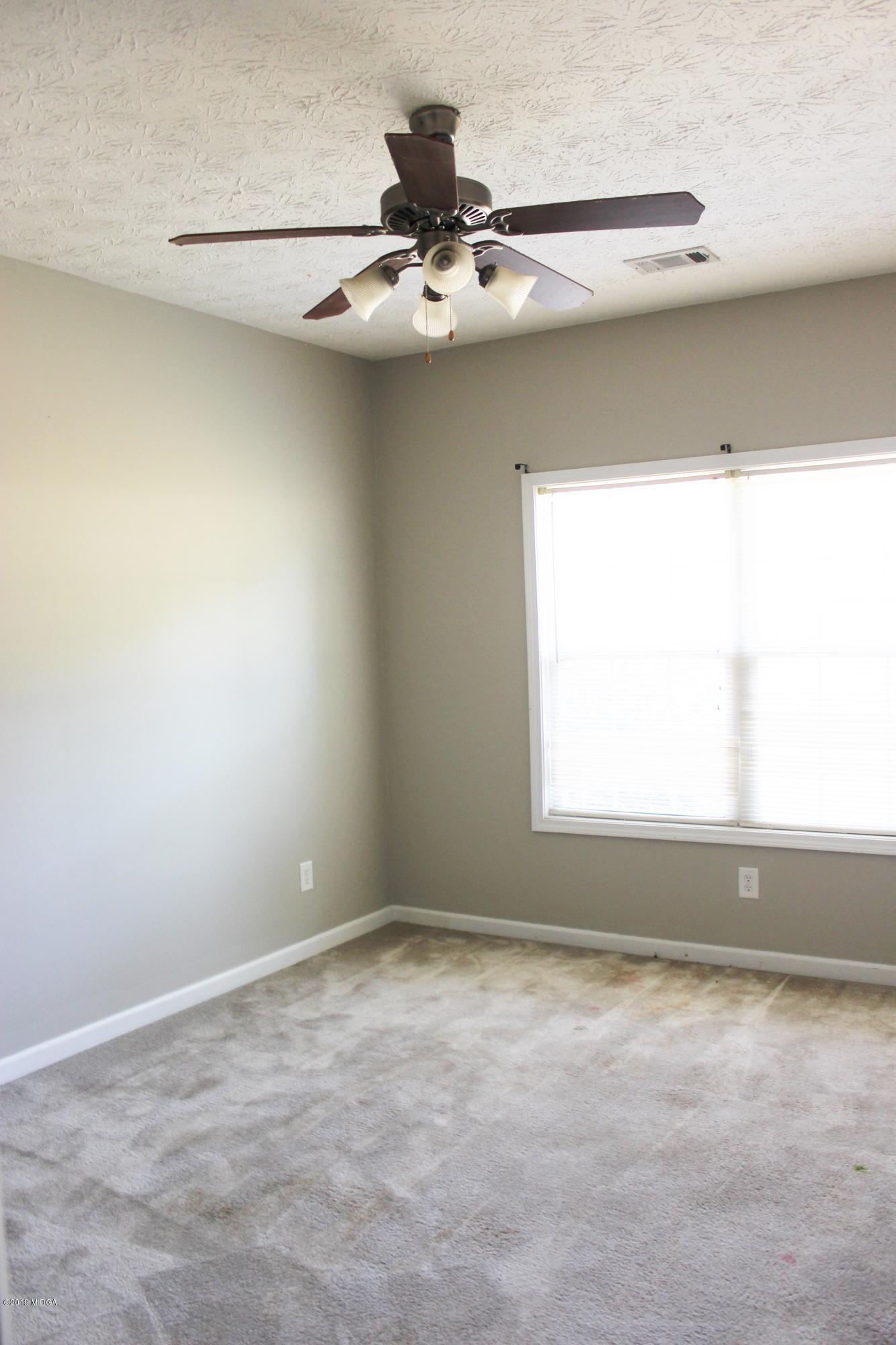 318 Hickory Road Jackson, GA 30233 - Photo 5 of 13 a view of a window in an empty room