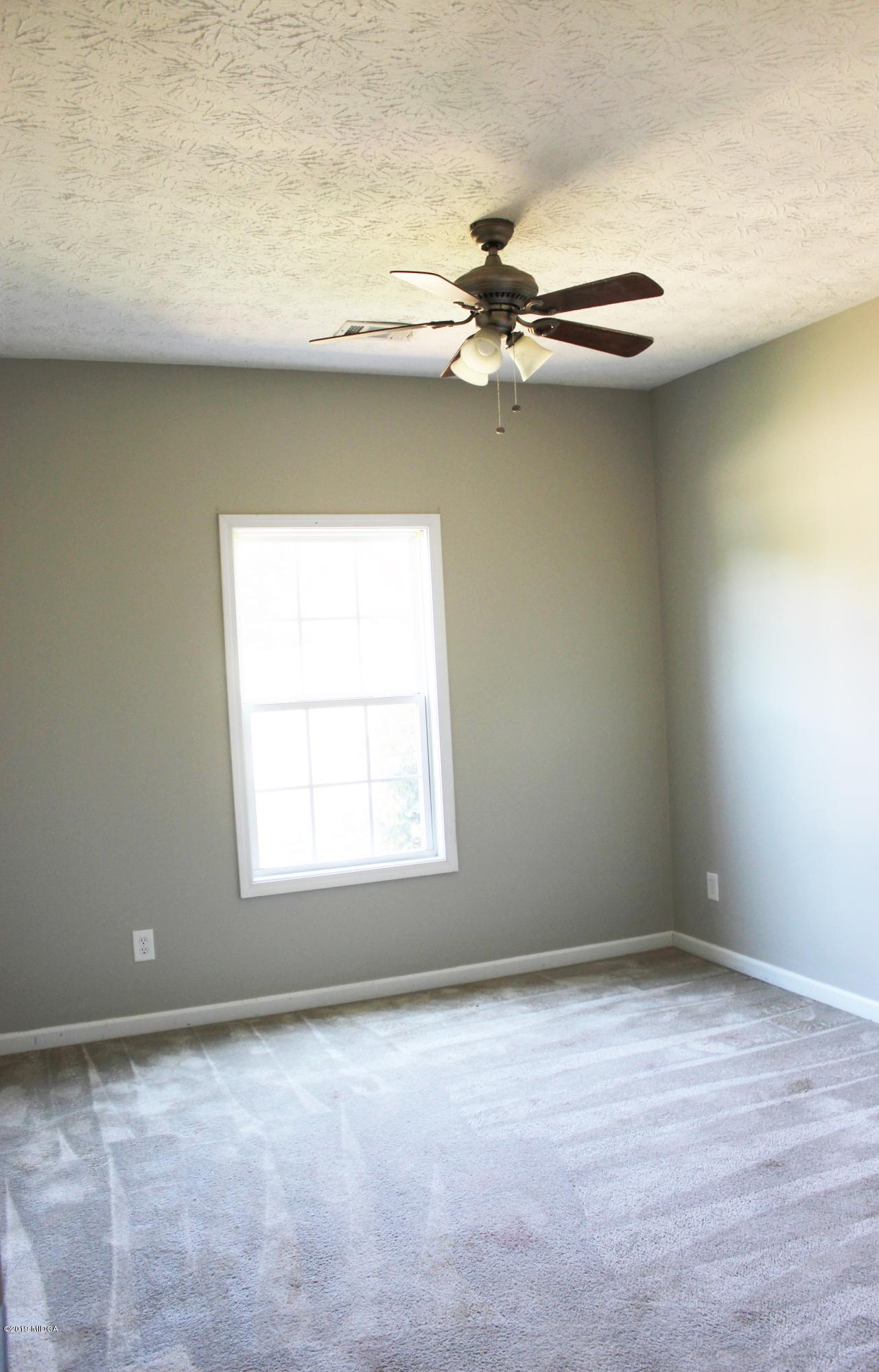 318 Hickory Road Jackson, GA 30233 - Photo 6 of 13 an empty room with a window