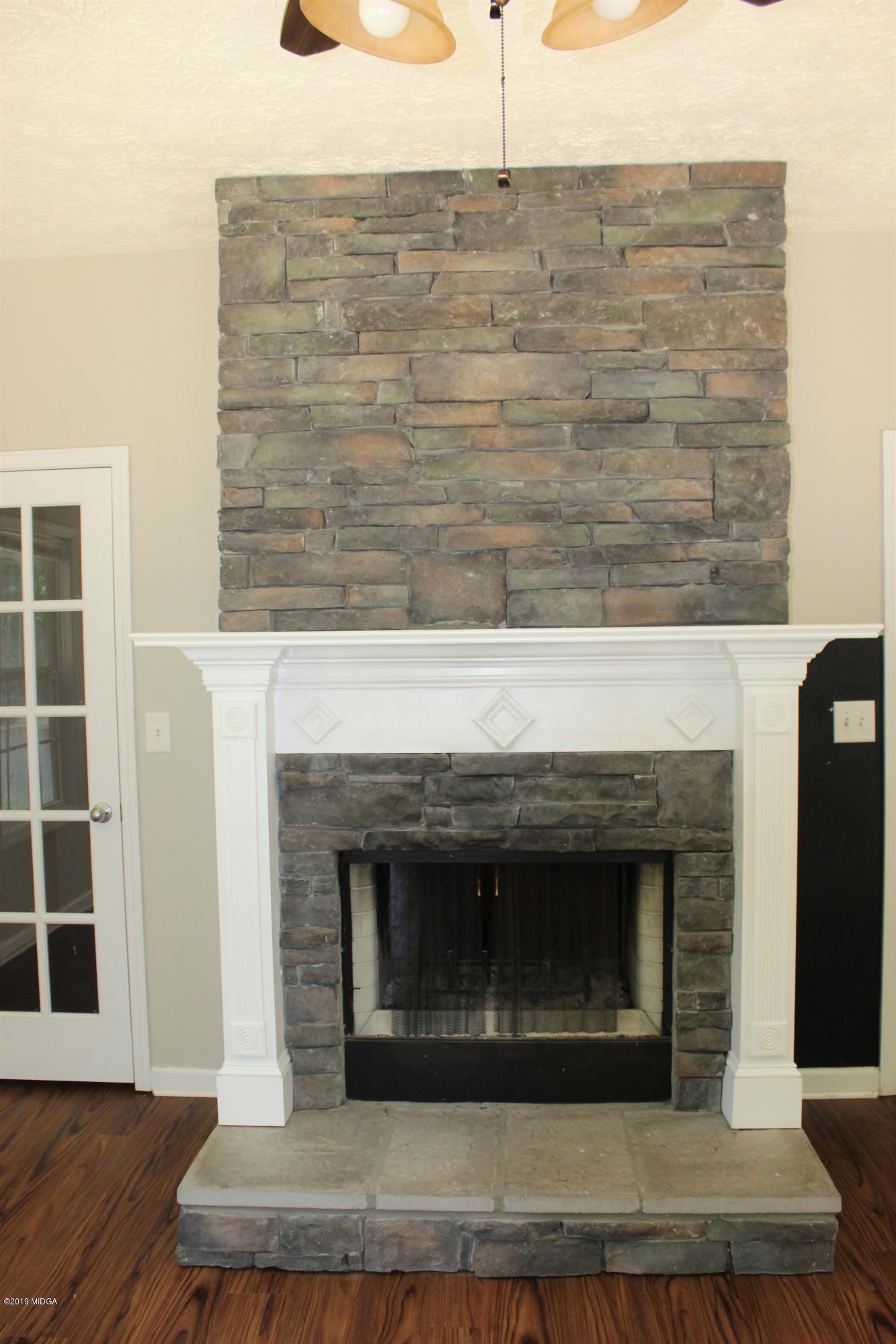 318 Hickory Road Jackson, GA 30233 - Photo 8 of 13 a living room with a fireplace