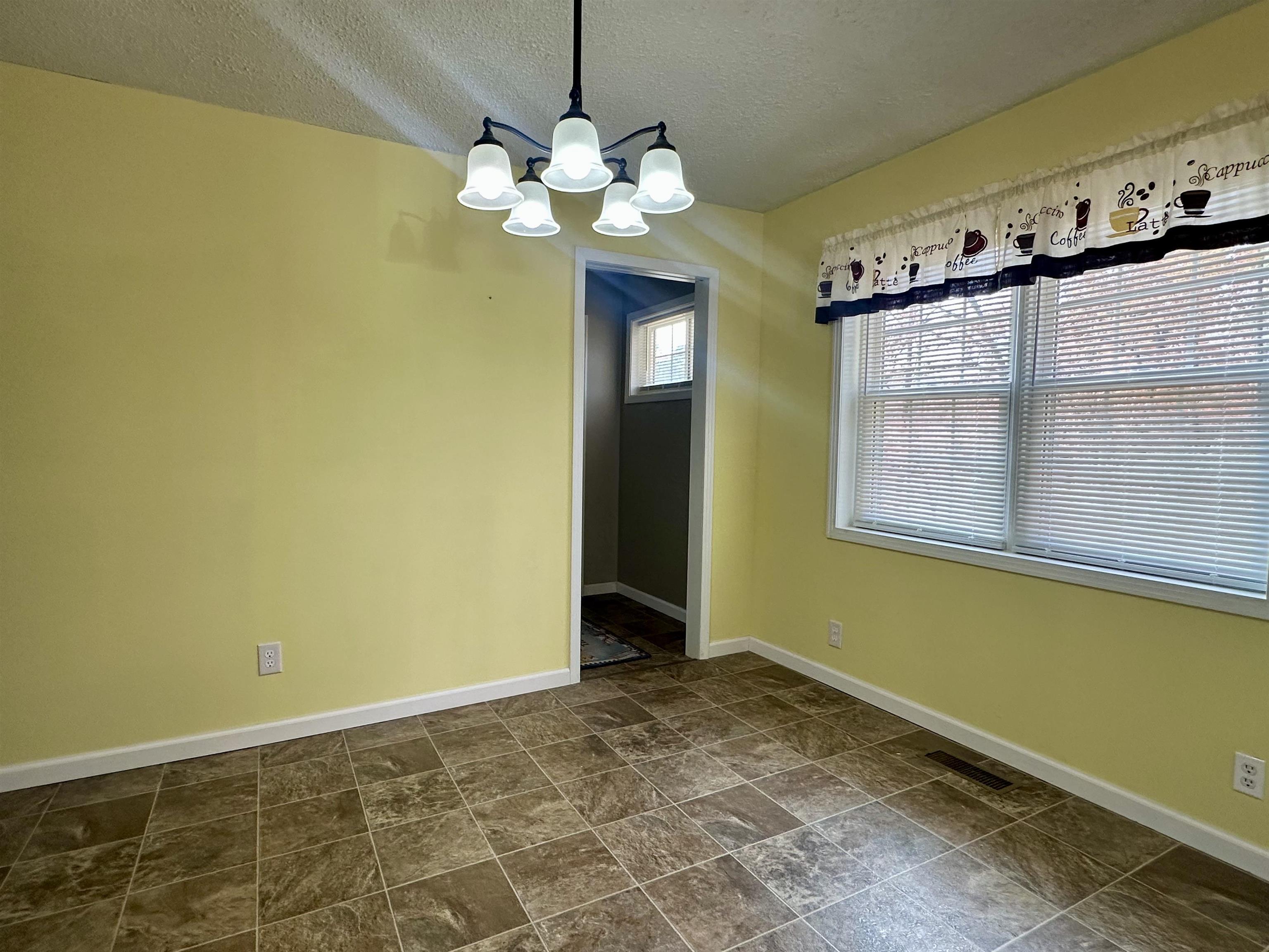 170 Mitchell Street Selmer, TN 38375 - Photo 14 of 26 a view of a bedroom with a window